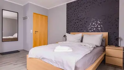 Ein Bett oder Betten in einem Zimmer der Unterkunft Ferienwohnung Dominique