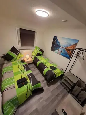 Ein Bett oder Betten in einem Zimmer der Unterkunft GR ooms-Rent