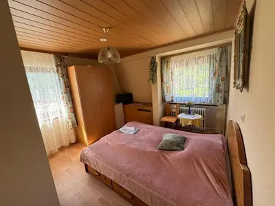 Ein Bett oder Betten in einem Zimmer der Unterkunft Hotel Garni Neckarblick