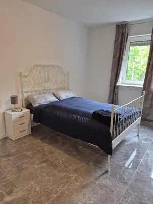 Ein Bett oder Betten in einem Zimmer der Unterkunft Tami