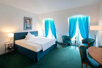Ein Bett oder Betten in einem Zimmer der Unterkunft Hotel Artrium am Park