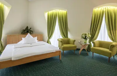 Ein Bett oder Betten in einem Zimmer der Unterkunft Hotel Artrium am Park