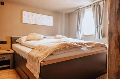 Ein Bett oder Betten in einem Zimmer der Unterkunft Schmuckers Ferienstube