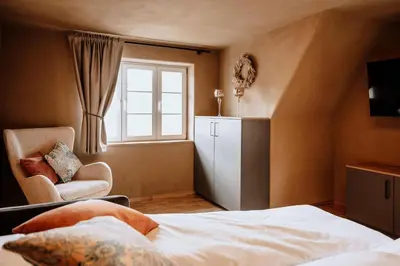 Ein Bett oder Betten in einem Zimmer der Unterkunft Schmuckers Ferienstube