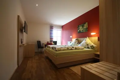 Ein Bett oder Betten in einem Zimmer der Unterkunft Gästehaus Bourdy