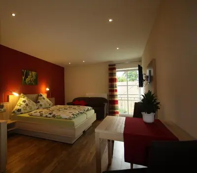 Ein Bett oder Betten in einem Zimmer der Unterkunft Gästehaus Bourdy