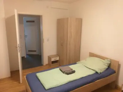 Ein Bett oder Betten in einem Zimmer der Unterkunft Monteurwohnung in Eisenberg Pfalz