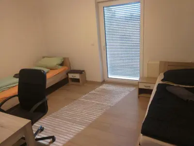 Ein Bett oder Betten in einem Zimmer der Unterkunft Monteurwohnung in Eisenberg Pfalz