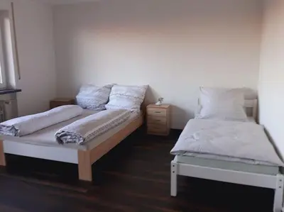 Ein Bett oder Betten in einem Zimmer der Unterkunft J&V Zimmer II Walldürn