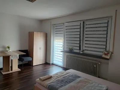 Ein Bett oder Betten in einem Zimmer der Unterkunft J&V Zimmer II Walldürn