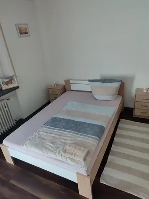 Ein Bett oder Betten in einem Zimmer der Unterkunft J&V Zimmer II Walldürn