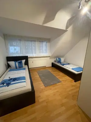 Ein Bett oder Betten in einem Zimmer der Unterkunft Ferienwohnung Albstern