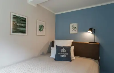 Ein Bett oder Betten in einem Zimmer der Unterkunft Wohnpark Hotel Heppenheim