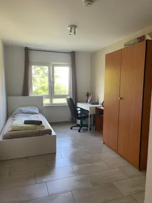 Ein Bett oder Betten in einem Zimmer der Unterkunft Apartment in Karlsruhe Neureut