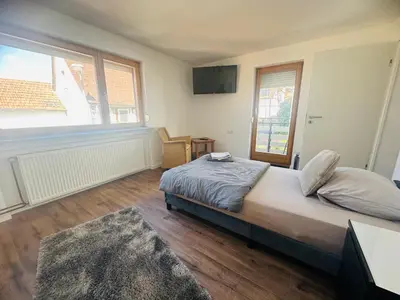 Ein Bett oder Betten in einem Zimmer der Unterkunft Gästehaus mit 3 MiniAppartments in Gr-Umstadt