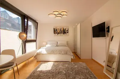 Ein Bett oder Betten in einem Zimmer der Unterkunft Exklusive 1-Zimmer-Wohnung in KA-Stadt