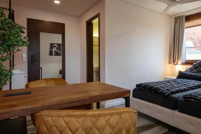 Ein Bett oder Betten in einem Zimmer der Unterkunft NECKARWESTHEIMER Hotel