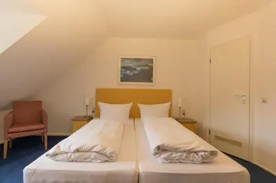 Ein Bett oder Betten in einem Zimmer der Unterkunft Hotel Am Kornmarkt