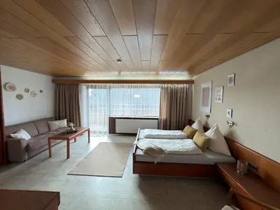 Ein Bett oder Betten in einem Zimmer der Unterkunft Hotel Garni Sebastian