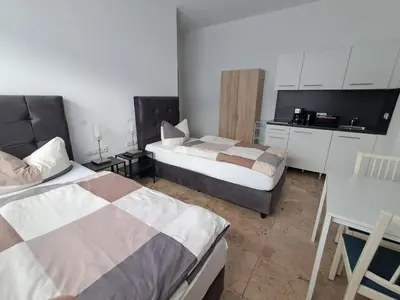 Ein Bett oder Betten in einem Zimmer der Unterkunft Boardinghouse Wildbachtal