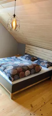 Ein Bett oder Betten in einem Zimmer der Unterkunft Ferienwohnung Hennrich