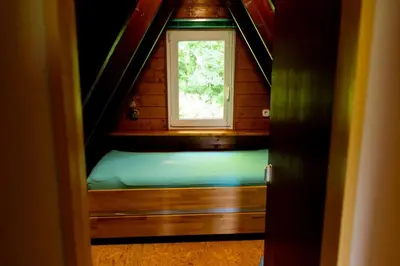 Ein Bett oder Betten in einem Zimmer der Unterkunft Roter Fuchsbau am Eichwald