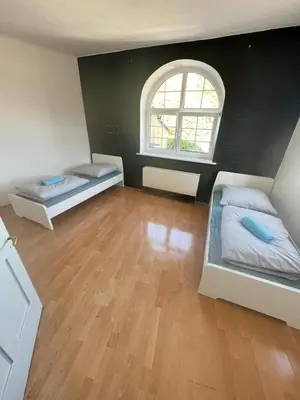 Ein Bett oder Betten in einem Zimmer der Unterkunft Monteurwohnung Erdgeschoss Birkenfeld - Karlsruhe 25min