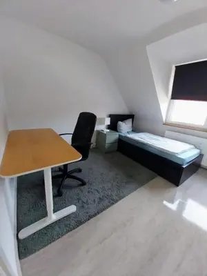 Ein Bett oder Betten in einem Zimmer der Unterkunft Monteurwohnung - Bertholdstraße 19