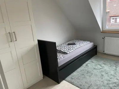 Ein Bett oder Betten in einem Zimmer der Unterkunft Monteurwohnung - Bertholdstraße 19