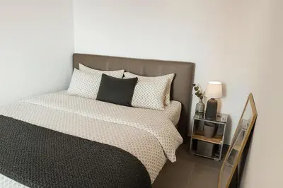 Ein Bett oder Betten in einem Zimmer der Unterkunft Modernes 2-Zi -Apartment in Bad Friedrichshall WLAN Küche und Waschmaschine