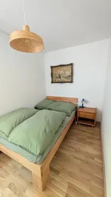 Ein Bett oder Betten in einem Zimmer der Unterkunft Charlottes Waldresidenz