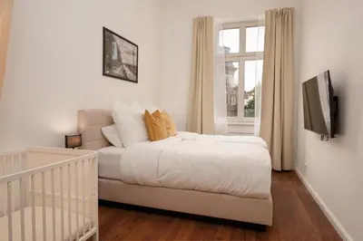 Ein Bett oder Betten in einem Zimmer der Unterkunft Wohnkultur - Altbau Charme für 8 Personen