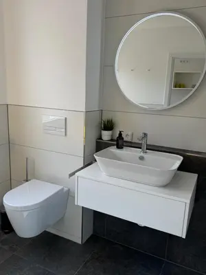 Ein Badezimmer in der Unterkunft Ferienwohnung Lemon - Suite