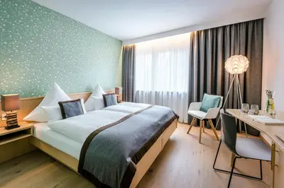 Ein Bett oder Betten in einem Zimmer der Unterkunft Hotel Krone