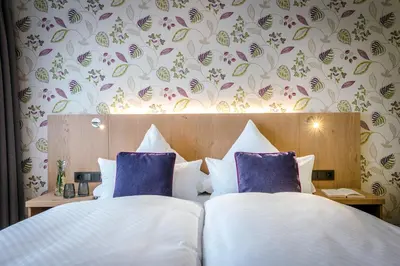 Ein Bett oder Betten in einem Zimmer der Unterkunft Hotel Krone