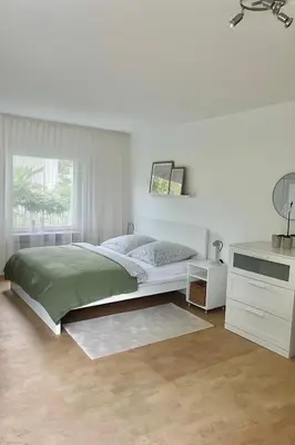 Ein Bett oder Betten in einem Zimmer der Unterkunft REHBLICK Ferienwohnung