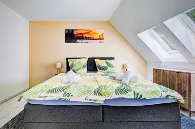Ein Bett oder Betten in einem Zimmer der Unterkunft Zentrales City Appartement Worms