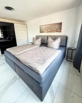 Ein Bett oder Betten in einem Zimmer der Unterkunft 2 Zimmer Apartment mit Sauna