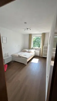 Ein Bett oder Betten in einem Zimmer der Unterkunft Book your Room in Darmstadt City