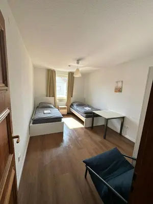 Ein Bett oder Betten in einem Zimmer der Unterkunft Book your Room in Darmstadt City