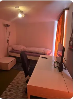 Ein Bett oder Betten in einem Zimmer der Unterkunft Ferienzimmer in bad friedrichshall