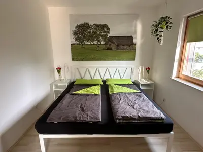 Ein Bett oder Betten in einem Zimmer der Unterkunft Sunnyside - Modern holiday apartment Pfungstadt