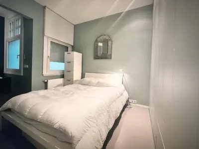 Ein Bett oder Betten in einem Zimmer der Unterkunft House of Art