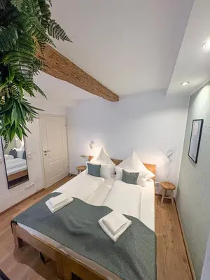 Ein Bett oder Betten in einem Zimmer der Unterkunft Wohnen in der Altstadt - Wohnungen und Studio