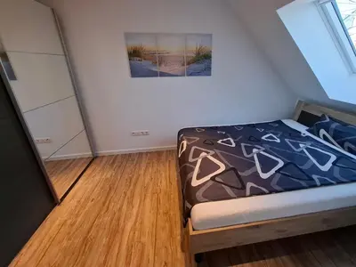 Ein Bett oder Betten in einem Zimmer der Unterkunft Moderne DG-Wohnung mit Flair in guter Lage