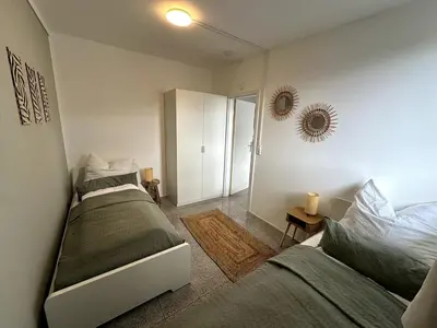 Ein Bett oder Betten in einem Zimmer der Unterkunft BookieB Apartment by Schmitt