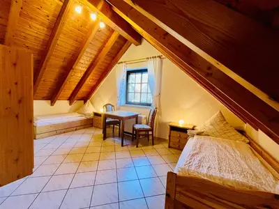 Ein Bett oder Betten in einem Zimmer der Unterkunft Ins Scholze große und kleine Ferienwohnungen in Albersbach