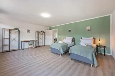 Ein Bett oder Betten in einem Zimmer der Unterkunft Übernachten im Kulturdenkmal - Weinort