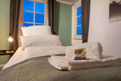 Ein Bett oder Betten in einem Zimmer der Unterkunft Übernachten im Kulturdenkmal - Weinort