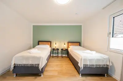 Ein Bett oder Betten in einem Zimmer der Unterkunft CharmÖHR Homes